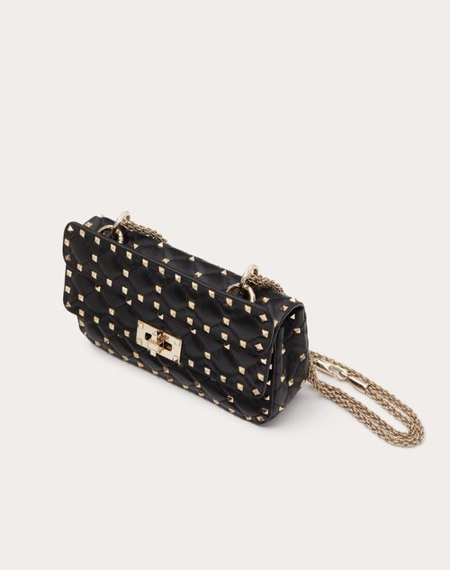 Black purse with clearance spikes