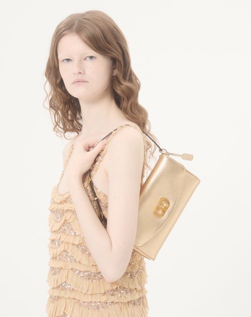 Valentino Garavani - Valentino Garavani Devain Small Shoulder Bag In Laminated Nappa Leather - Gold - Woman - Shoulder Bags