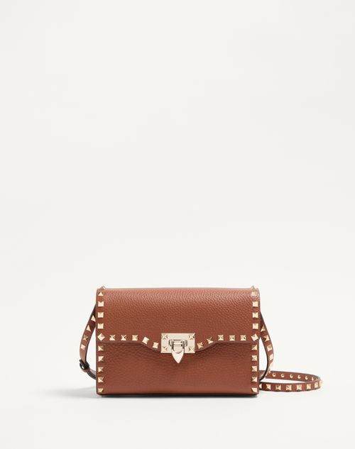 Valentino Garavani - SMALL ROCKSTUD GRAINY CALFSKIN CROSSBODY BAG - Saddle Brown - Woman - Bags