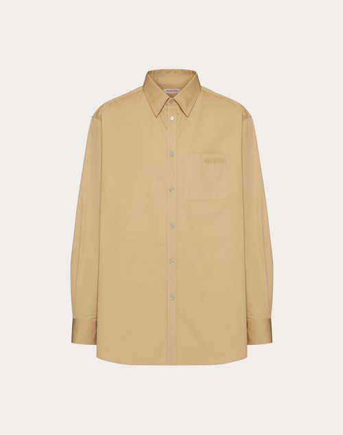 beige color button up shirt
