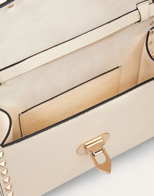 Small Rockstud Grainy Calfskin Crossbody Bag for Woman in Saddle