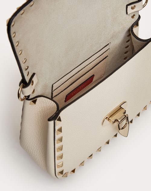 Small Rockstud Grainy Calfskin Handbag for Woman in Poudre 