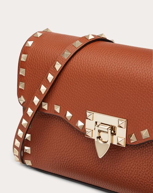 Small Rockstud Grainy Calfskin Crossbody Bag for Woman in Poudre