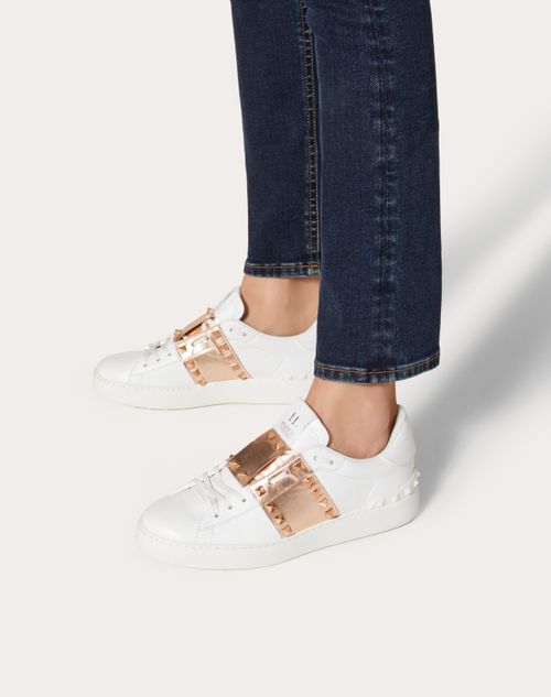 Rockstud Sneaker In Calfskin Leather With Metallic Stripe for Woman in White/copper | Valentino US