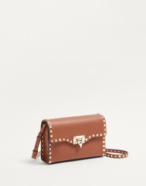 Valentino Garavani - SMALL ROCKSTUD GRAINY CALFSKIN CROSSBODY BAG - Saddle Brown - Woman - Bags