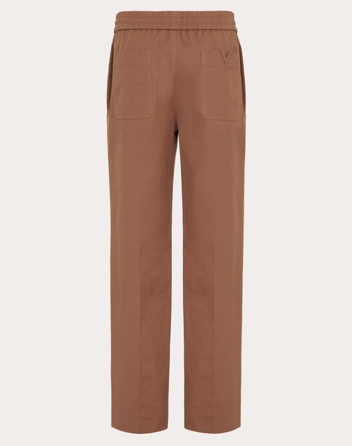 Valentino - Stretch Cotton Canvas Pants With Rubberized V Detail - Clay - Man - Pants And Shorts