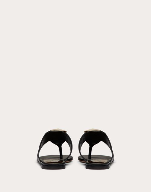 One Stud Calfskin Flat Thong Sandal for Woman in Black | Valentino US