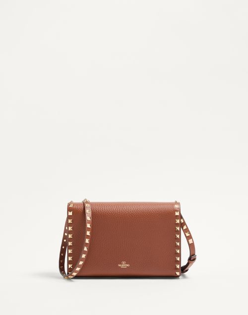 Valentino Garavani - SMALL ROCKSTUD GRAINY CALFSKIN CROSSBODY BAG - Saddle Brown - Woman - Bags