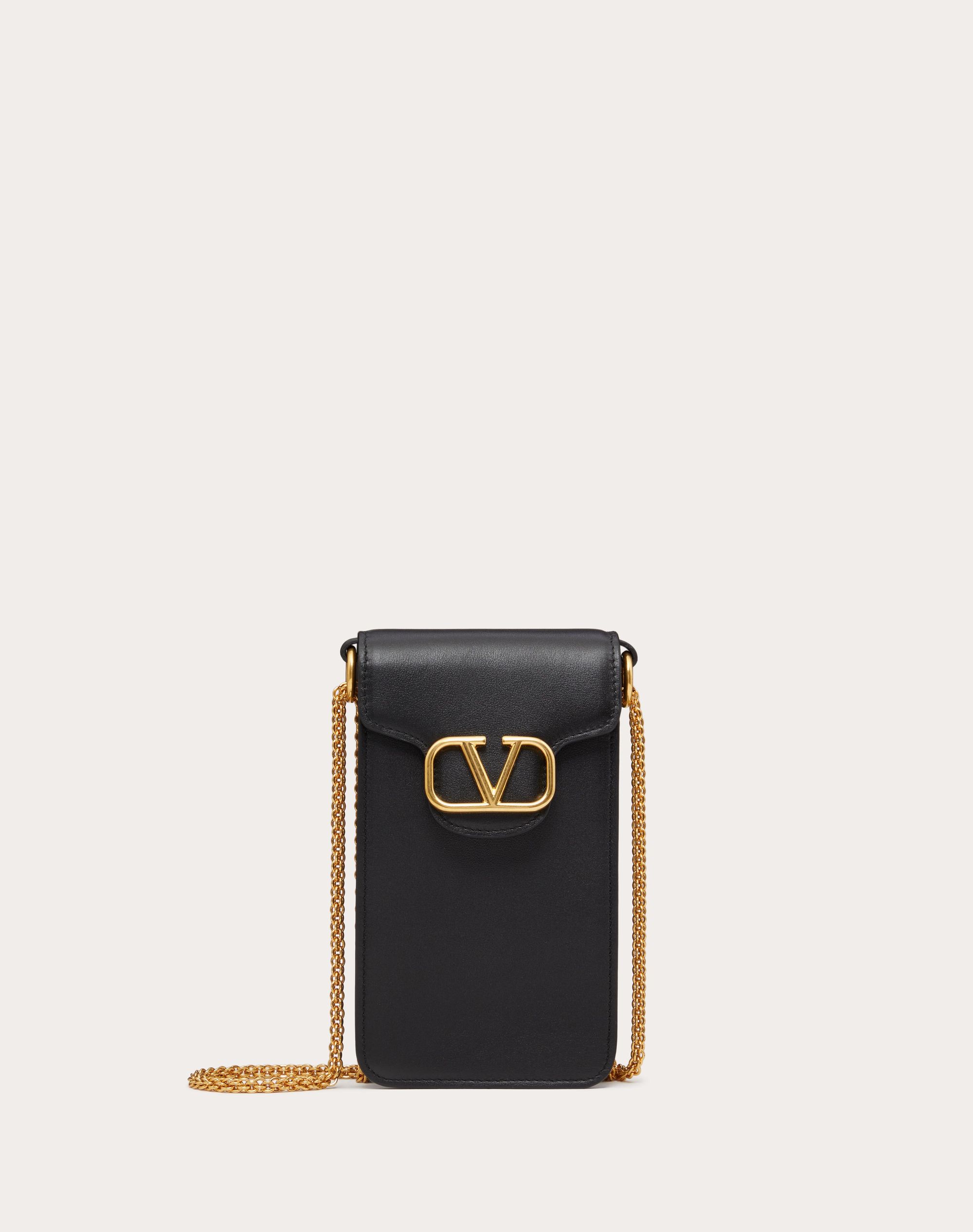 Image of a black Valentino Garavani phone holder with golden chain