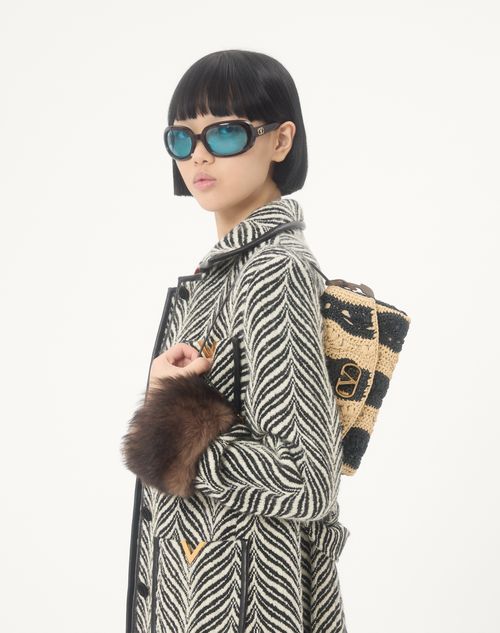 Valentino Garavani - Valentino Garavani Devain Small Shoulder Bag In Raffia With Wave Pattern - Natural/black - Woman - Shoulder Bags