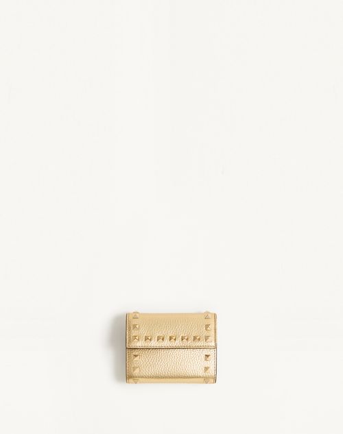 Valentino Garavani Rockstud Trifold Wallet In Laminated Grainy Calfskin Woman Antique Brass Uni In Antique Brass