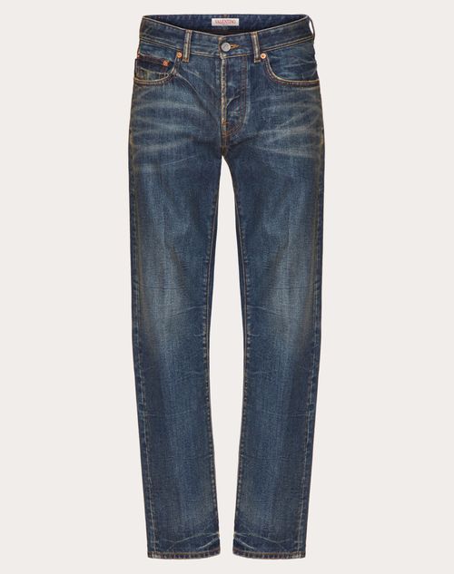 Shop Valentino Denim Trousers With Metallic V Detail In デニム